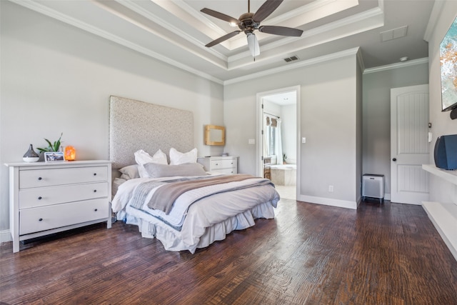 bedroom featuring ensuite bath, a raised ceiling, ceiling fan, dark wood-type flooring, and crown molding