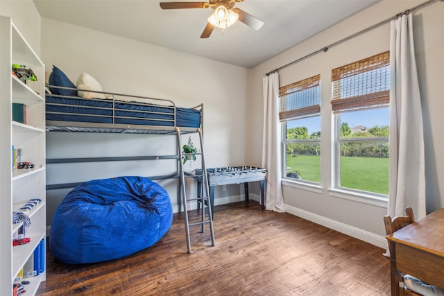 bedroom with wood-type flooring and ceiling fan