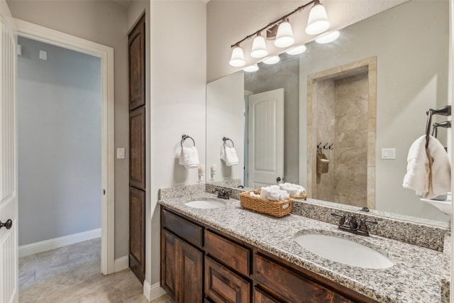 7817 Bella Flora Dr, Fort Worth, TX 76126 - full bath featuring double vanity, tiled shower, and a sink