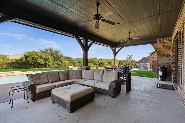 view of patio featuring a pool, an outdoor living space, and ceiling fan