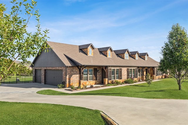 cape cod home featuring a front yard and a garage