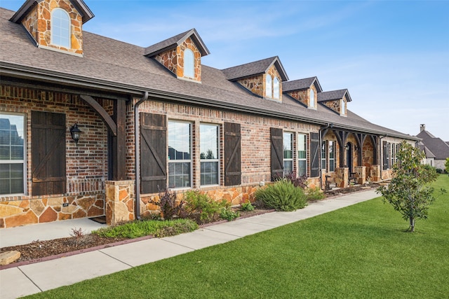 view of side of home featuring a yard