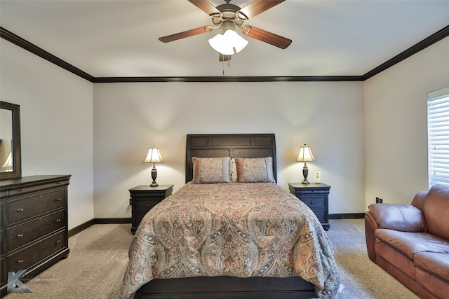 carpeted bedroom featuring crown molding and ceiling fan