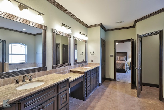 133 Prairie Creek Way, Abilene, TX 79602 - ensuite bathroom with double vanity, ornamental molding, tile patterned floors, a garden tub, and baseboards