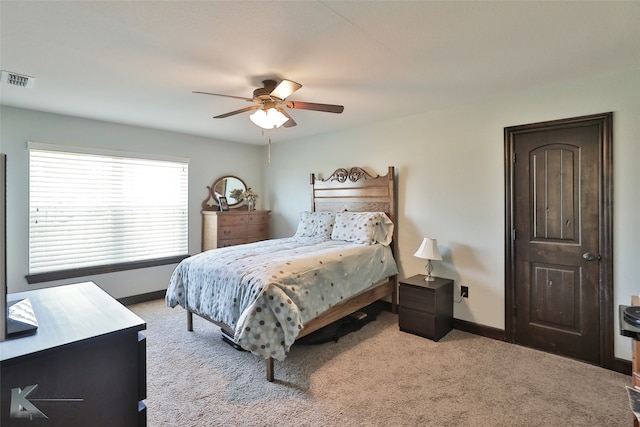 bedroom with light colored carpet and ceiling fan