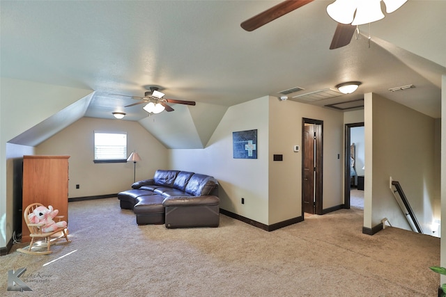 living room featuring lofted ceiling, light colored carpet, and ceiling fan