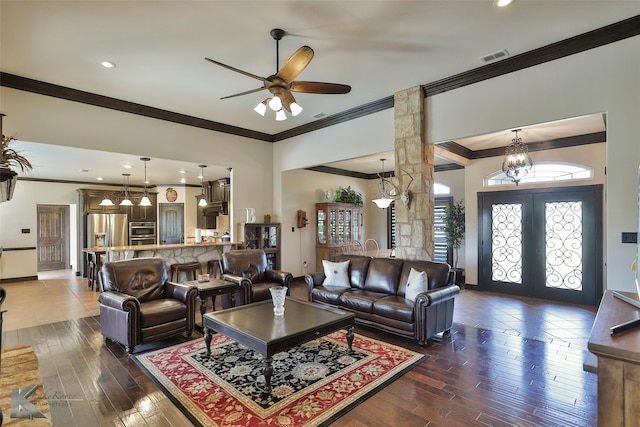 living room featuring french doors, ornamental molding, ceiling fan, and dark hardwood / wood-style flooring