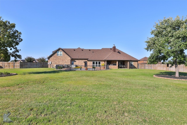 133 Prairie Creek Way, Abilene, TX 79602 - rear view of house with brick siding and a chimney