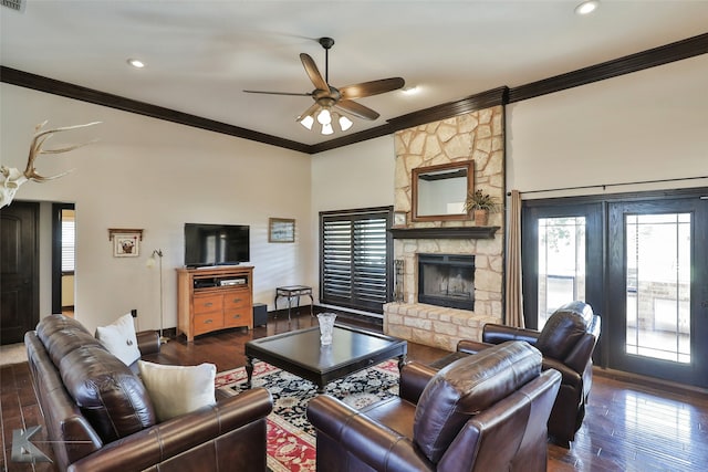 living room with crown molding, ceiling fan, a fireplace, and dark hardwood / wood-style flooring