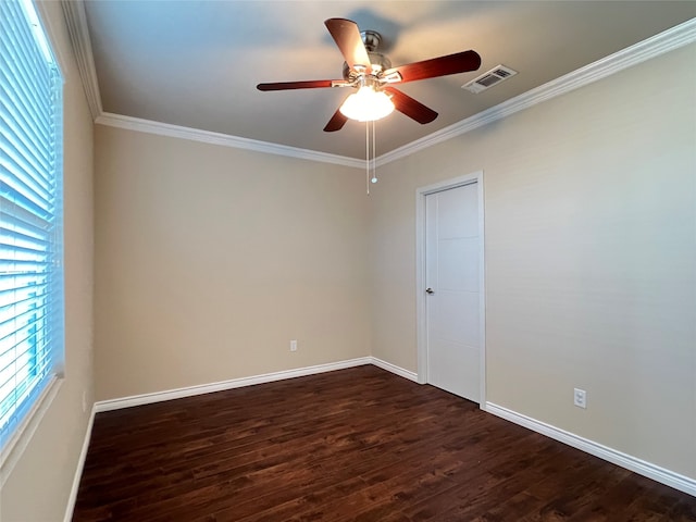 spare room with ornamental molding, dark wood-type flooring, and ceiling fan