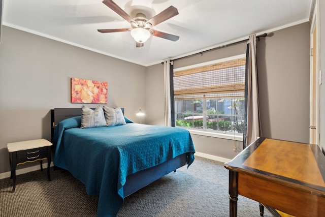 bedroom with ceiling fan, crown molding, and carpet