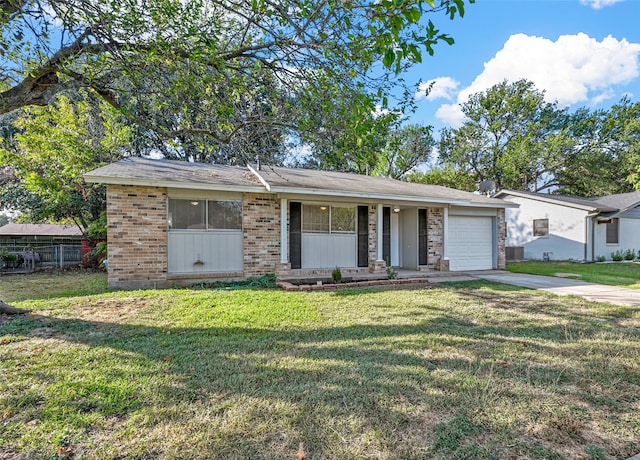 view of front facade with a porch, a front lawn, central AC unit, and a garage