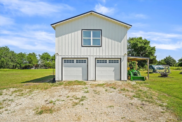 garage with a lawn