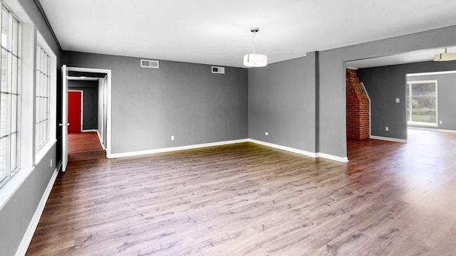 empty room featuring wood-type flooring