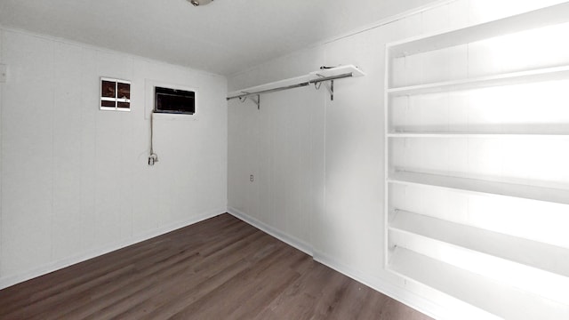 walk in closet featuring dark hardwood / wood-style floors