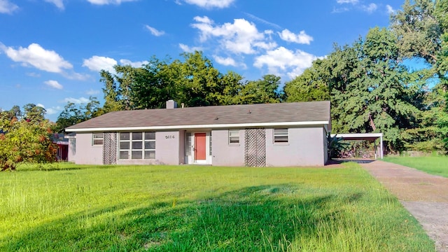 ranch-style house with a front lawn