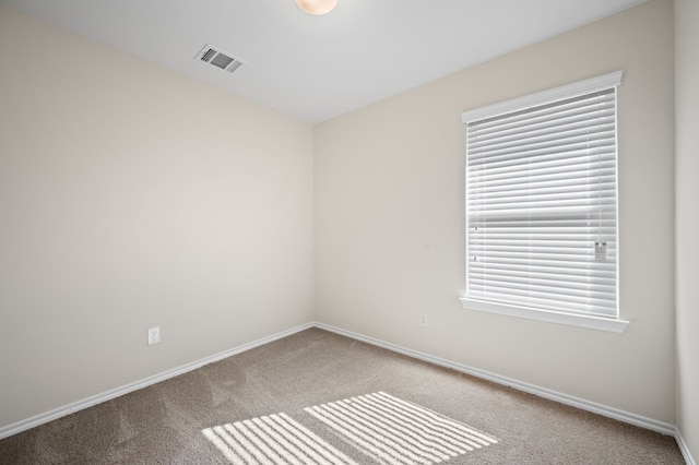 view of carpeted spare room