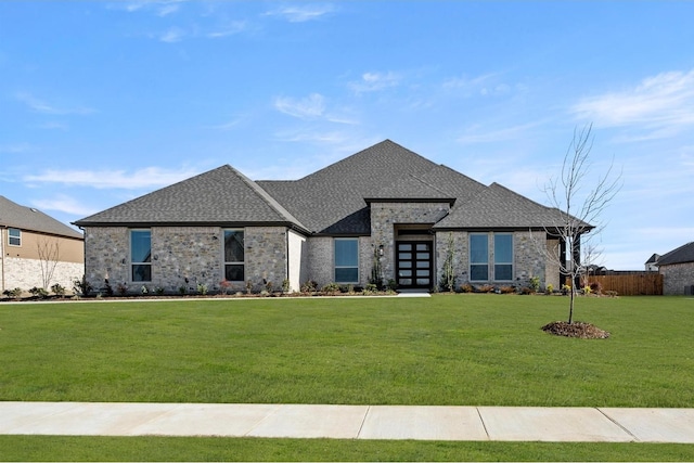 view of front of home featuring french doors and a front yard