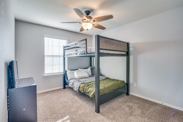 unfurnished bedroom with ceiling fan and light carpet