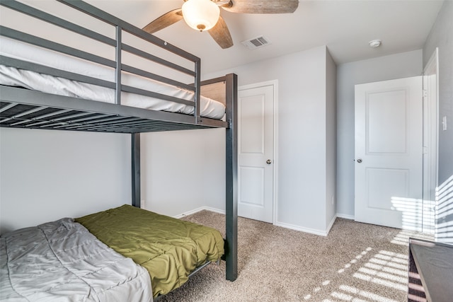 bedroom with ceiling fan and carpet