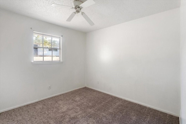 empty room with carpet floors, a textured ceiling, baseboards, and ceiling fan