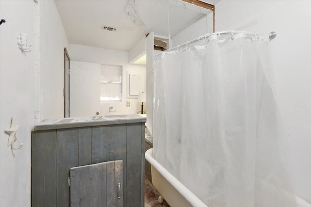 bathroom featuring vanity and walk in shower