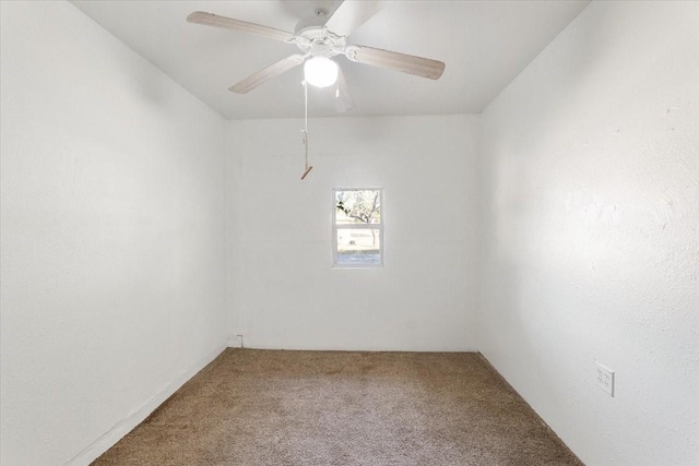 unfurnished room with carpet floors and a ceiling fan