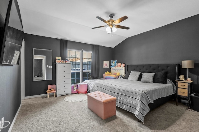 carpeted bedroom with ceiling fan and lofted ceiling