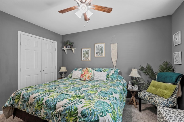 carpeted bedroom with a closet and ceiling fan