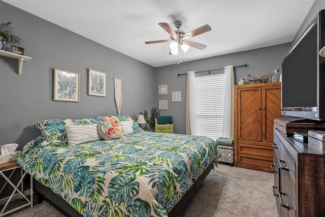 bedroom featuring light carpet and ceiling fan