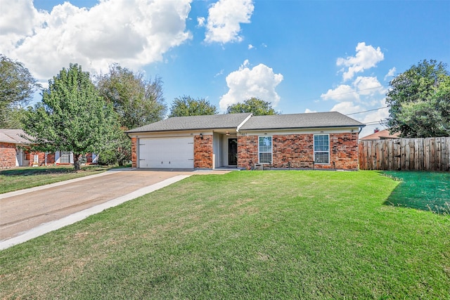 ranch-style house featuring a front lawn and a garage