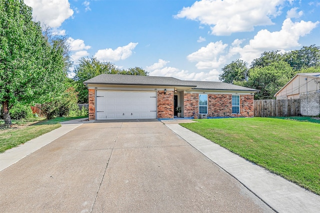 view of front of property with a front lawn and a garage