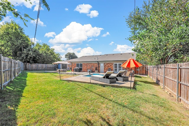 view of yard with a fenced in pool, a patio, and an outdoor hangout area