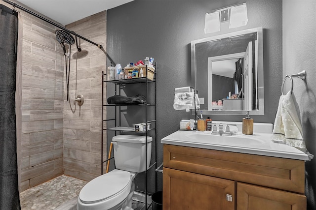 bathroom with vanity, toilet, and a shower with shower curtain