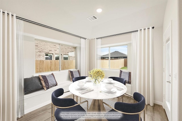 dining space featuring light wood-type flooring