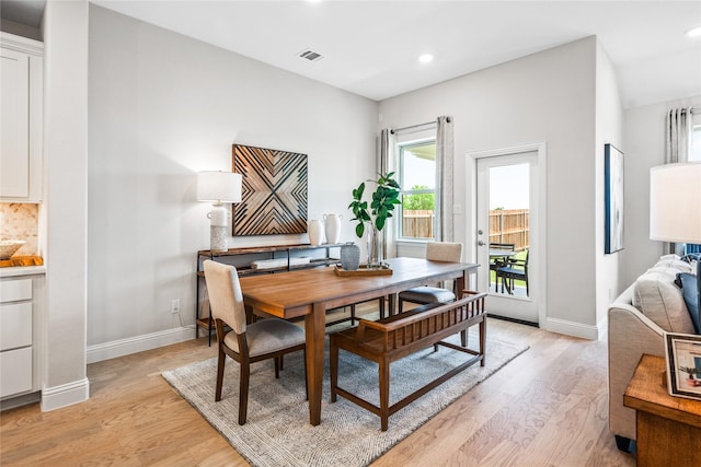 dining area with light hardwood / wood-style floors