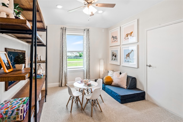 game room with ceiling fan and carpet flooring