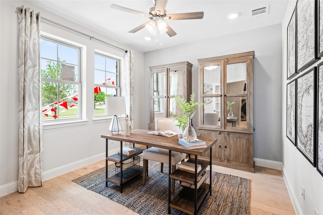 office area with light hardwood / wood-style flooring and ceiling fan