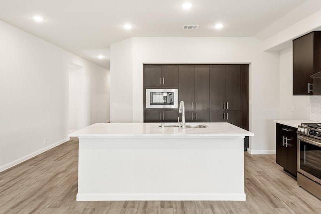 unfurnished living room featuring plenty of natural light and light wood-type flooring