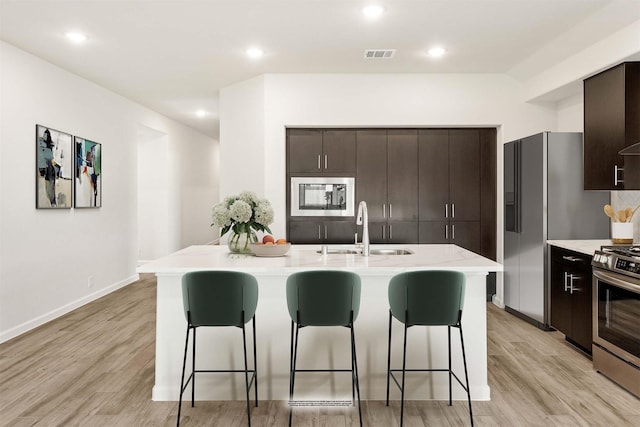 spare room featuring a wealth of natural light and light hardwood / wood-style flooring