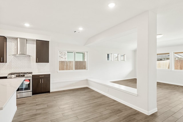 carpeted empty room featuring lofted ceiling