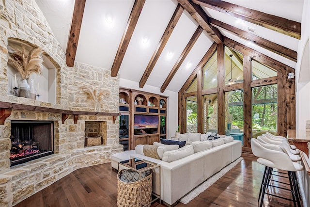 living room with a fireplace, beam ceiling, dark hardwood / wood-style floors, and high vaulted ceiling