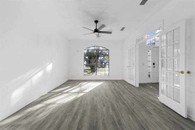 spare room with french doors, dark wood-type flooring, and ceiling fan