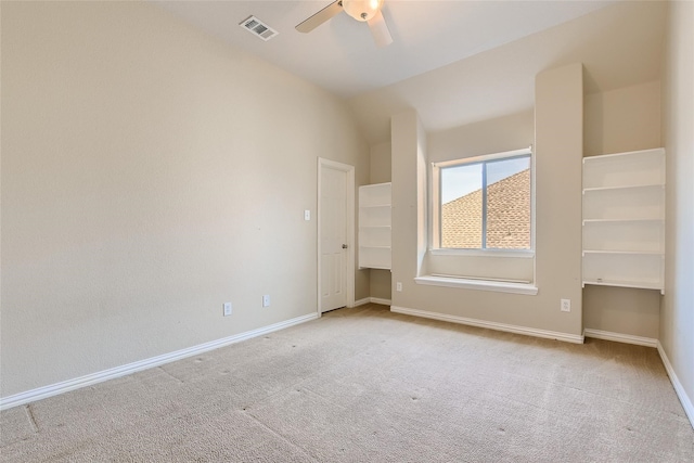 unfurnished bedroom with lofted ceiling, light carpet, and ceiling fan