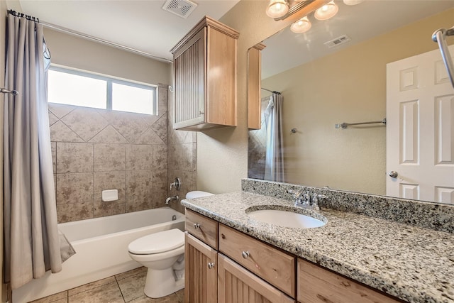 full bathroom with toilet, shower / bath combo, vanity, and tile patterned flooring