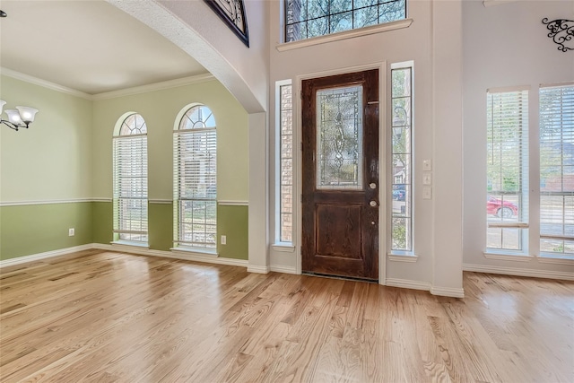 foyer entrance featuring plenty of natural light and light wood-type flooring