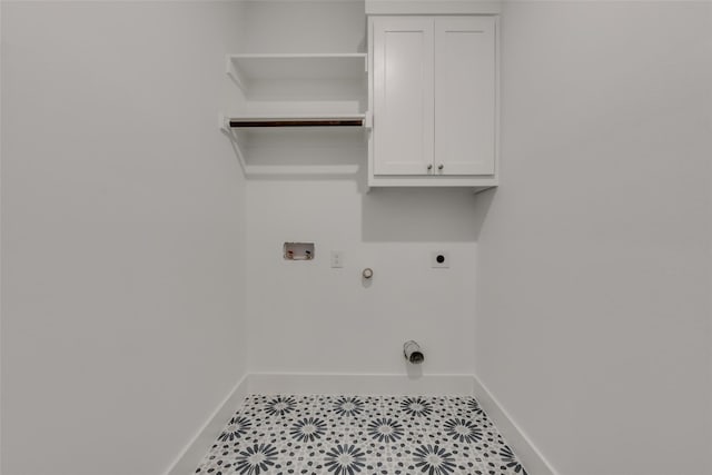 laundry room with cabinets, hookup for a washing machine, light tile patterned flooring, hookup for a gas dryer, and hookup for an electric dryer