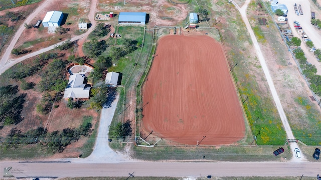 birds eye view of property with a rural view