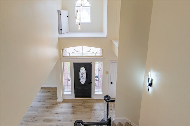 foyer entrance featuring light wood-type flooring and plenty of natural light