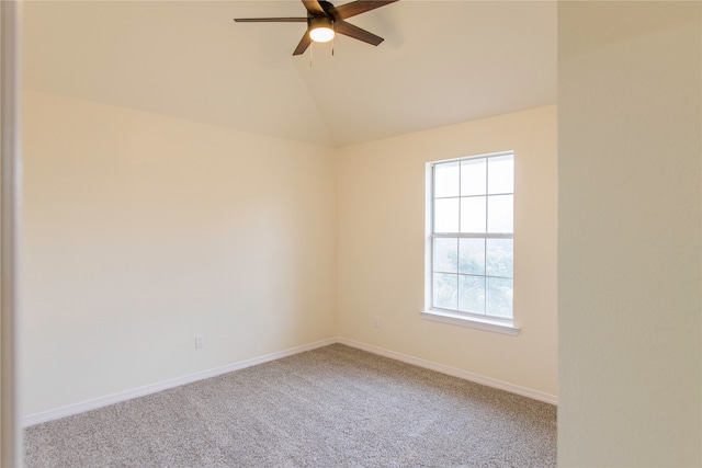 carpeted empty room featuring ceiling fan and lofted ceiling